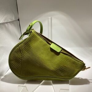 Christian Dior mini saddle bag in bright green lizard. A vintage piece.